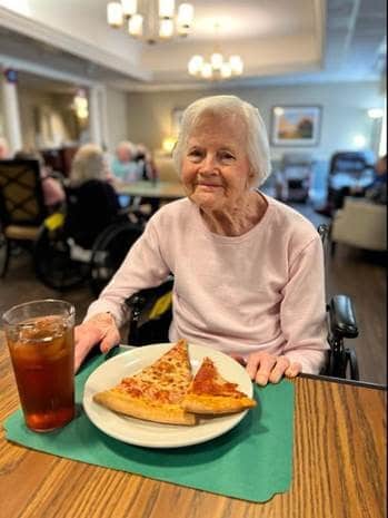 Senior woman at the Pizza Party