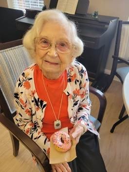Senior woman with donut