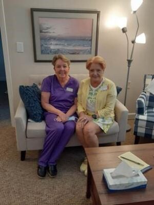 2 ladies-sitting-on-sofa